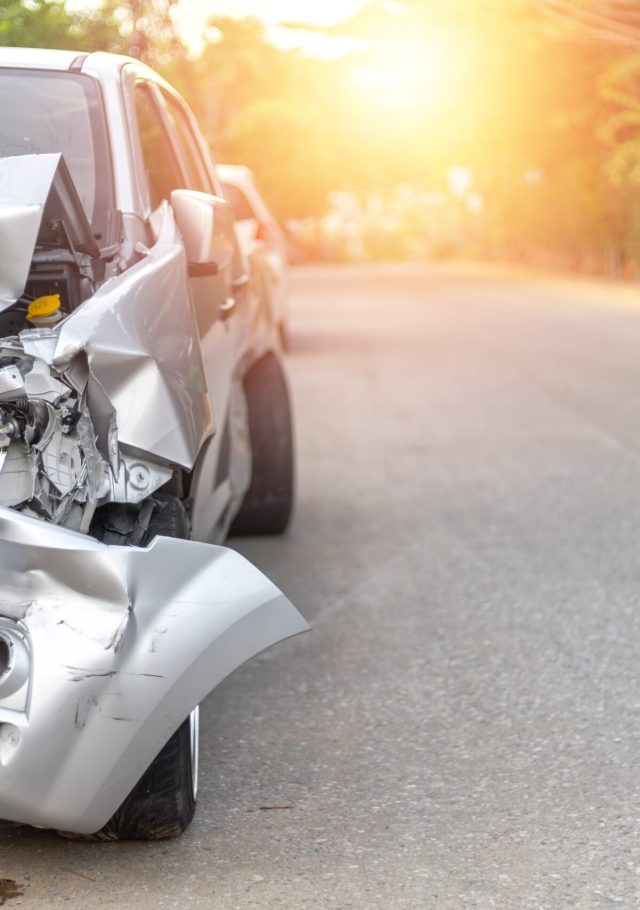 Front of light gray color car with pick up have big damaged and broken by accident on road in morning time can not drive any more park for wait insurance officer. With copy space for text or design Front of light gray color car with pick up have big damaged and broken by accident on road in morning time can not drive any more park for wait insurance officer. With copy space for text or design